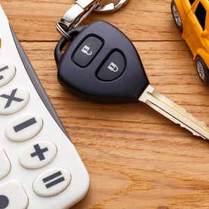 Calculator Car Key and a car toy on a desk
