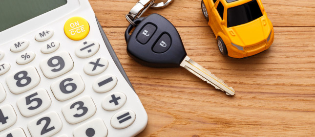 Calculator Car Key and a car toy on a desk